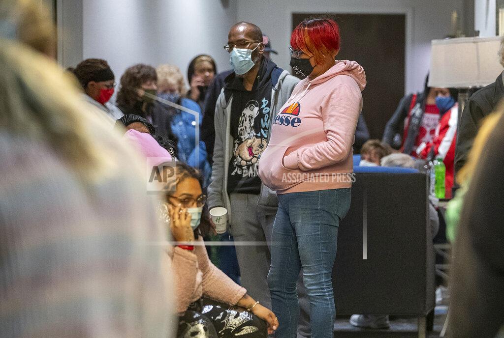 Mykal Mceldowney Family and friends wait for word of their loved ones who were at the FedEx Ground facility during a shooting in Indianapolis, Thursday night, April 15, 2021. Multiple people were shot and killed in a late-night shooting at a FedEx facility in Indianapolis, and the shooter killed himself, police said.(Mykal McEldowney/The Indianapolis Star via AP)