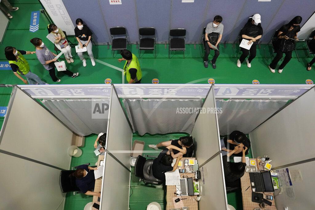 Ahn Young-Joon People receive the first dose of the Pfizer-BioNTech COVID-19 coronavirus vaccine at a vaccination center in Seoul, Wednesday, July 28, 2021. South Korea reported a new daily high for coronavirus cases, a day after authorities enforced stringent restrictions in areas outside the capital region. (AP Photo/Ahn Young-joon)