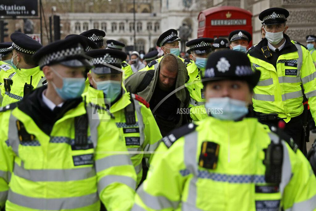 Matt Dunham A demonstrator is taken away by police during a 'Kill the Bill' protest in London, Saturday, April 3, 2021. The demonstration is against the contentious Police, Crime, Sentencing and Courts Bill, which is currently going through Parliament and would give police stronger powers to restrict protests. (AP Photo/Matt Dunham)
