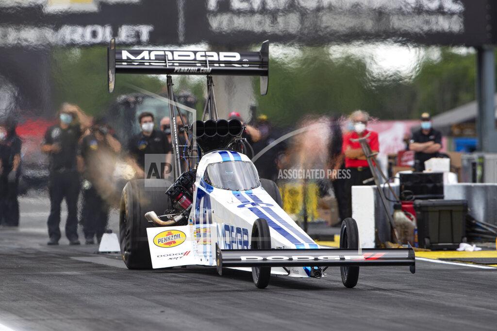Michael Conroy Leah Pritchett, in a Top Fuel dragster, launches from the starting line on a practice run for an NHRA drag racing event in Brownsburg, Ind., Friday, July 10, 2020. The NHRA returned to action last weekend near Indianapolis, in front of fans, on network television and amid hopes of a quick financial rebound following a 138-day season suspension. It was the kind of boost everybody needed. Teams and crew members are scrambling to pay the bills. Big questions remain for the world's premier drag-racing series. The pandemic is still a threat to disrupt the season or shut it down again. (AP Photo/Michael Conroy)