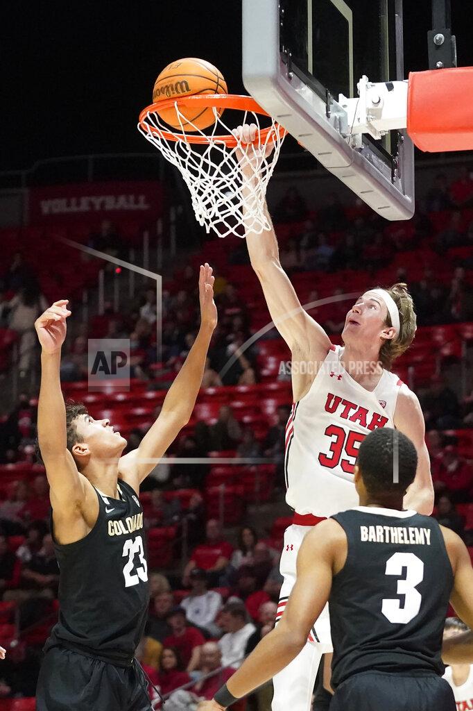 Rick Bowmer Utah center Branden Carlson (35) goes to the basket as Colorado forward Tristan da Silva (23) defends during the second half of an NCAA college basketball game Saturday, March 5, 2022, in Salt Lake City. (AP Photo/Rick Bowmer)