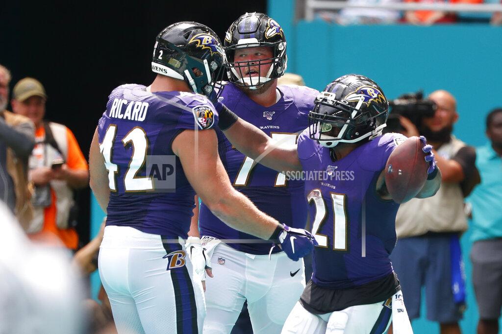 Wilfredo Lee Baltimore Ravens fullback Patrick Ricard (42) congratulates running back Mark Ingram (21) after Ingram scored a touchdown, during the first half at an NFL football game, Sunday, Sept. 8, 2019, in Miami Gardens, Fla. (AP Photo/Wilfredo Lee)