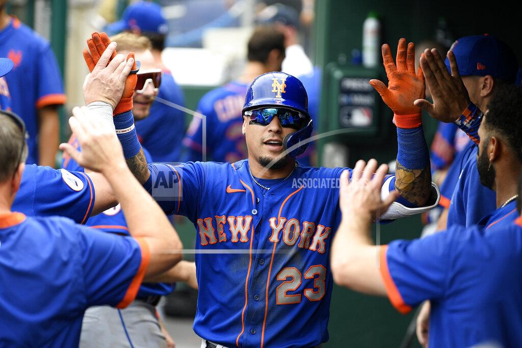 Nick Wass New York Mets' Javier Baez celebrates his home run in the dugout during the third inning of a baseball game against the Washington Nationals, Sunday, Sept. 5, 2021, in Washington. (AP Photo/Nick Wass)