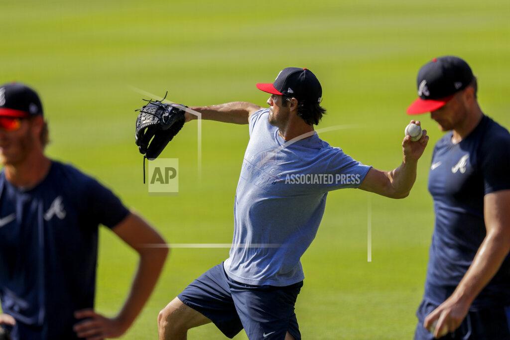Brynn Anderson Atlanta Braves' Cole Hamels, throws a ball during team practice at Truist Park on Sunday, July 5, 2020, in Atlanta. (AP Photo/Brynn Anderson)
