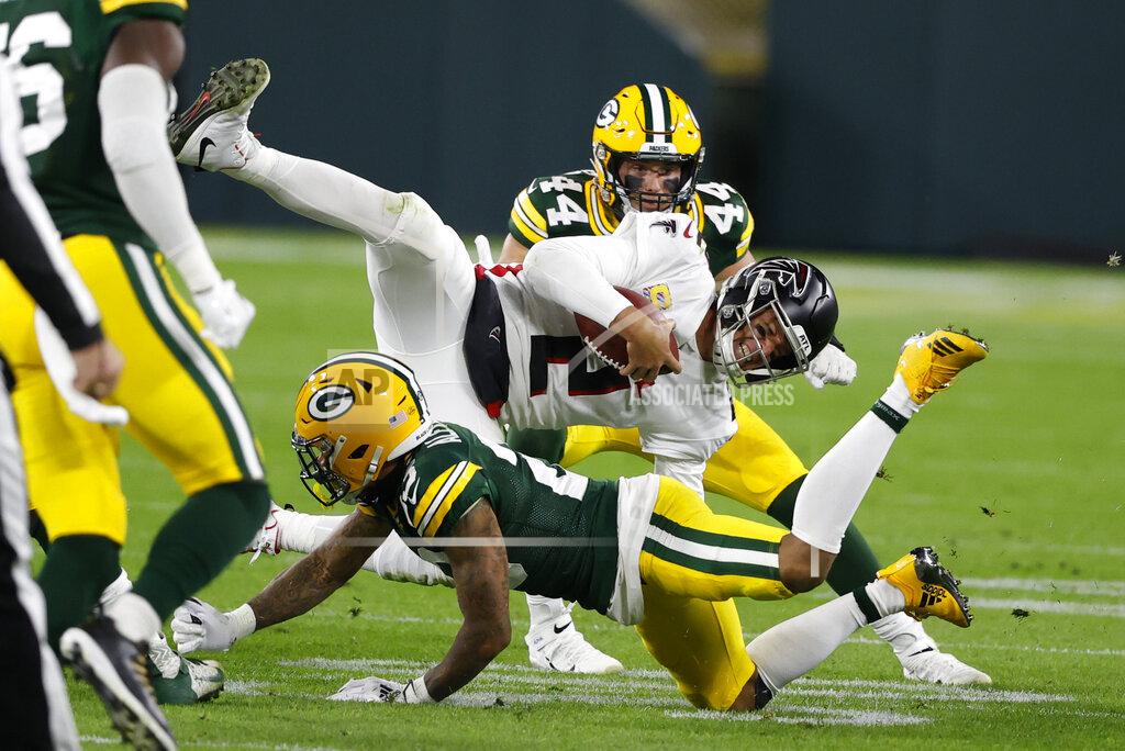Tom Lynn Atlanta Falcons quarterback Matt Ryan (2) is tackled by Green Bay Packers' Jaire Alexander (23) during the second half of an NFL football game, Monday, Oct. 5, 2020, in Green Bay, Wis. (AP Photo/Tom Lynn)