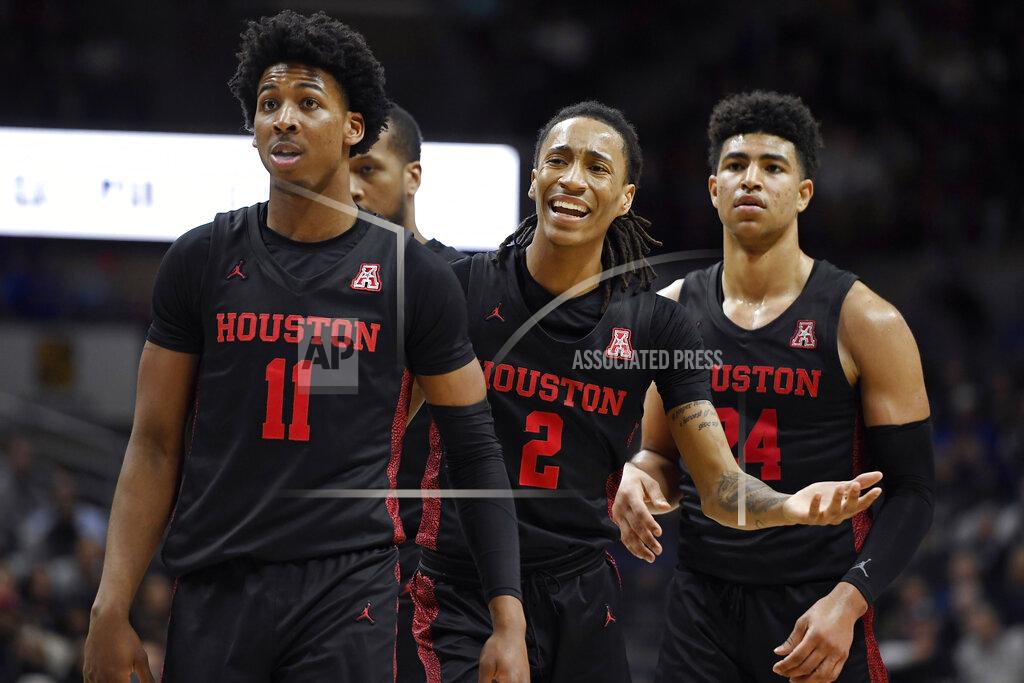 Jessica Hill Houston's Caleb Mills (2) reacts toward an official as Houston's Nate Hinton (11) and Houston's Quentin Grimes (24) look on in the second half of an NCAA college basketball game against Connecticut, Thursday, March 5, 2020, in Storrs, Conn. (AP Photo/Jessica Hill)