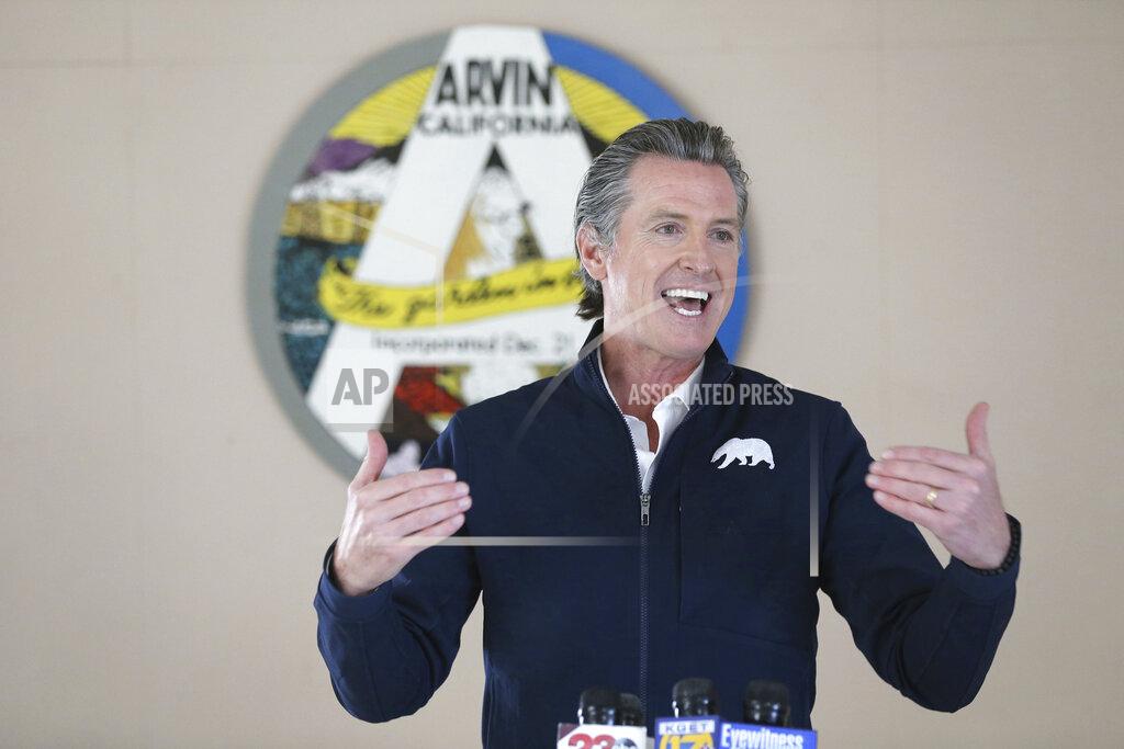 Alex Horvath Californian Governor Gavin Newsom talks during a visit to Arvin Veterans Hall in Arvin, Calif. in Kern County on Monday, Feb. 22, 2021, to highlight the state's efforts to administer COVID-19 vaccines quickly and equitably across California. Newsom said more vaccines are headed to California's vast Central Valley, an agricultural region that has been hard hit by the coronavirus. (Alex Horvath/Bakersfield Californian via AP)