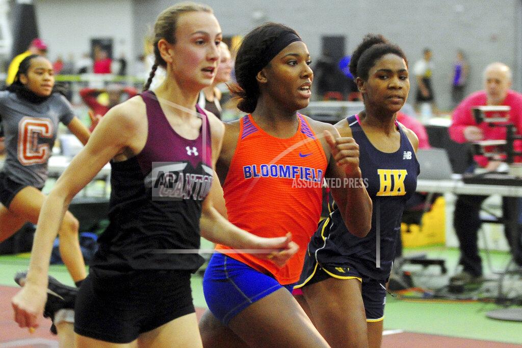 Christian Abraham In this Friday, Feb. 14, 2020 photo, Canton High School's Chelsea Mitchell, left, runs to beat Terry Miller, center, of Bloomfield, in the CIAC Class S track and field championships at Floyd Little Athletic Center in New Haven, Conn. center. Between 2017 and 2019, transgender sprinters Miller and Andraya Yearwood combined to win 15 championship races, prompting a lawsuit on behalf of four cisgender girls. (Christian Abraham/Hearst Connecticut Media via AP)