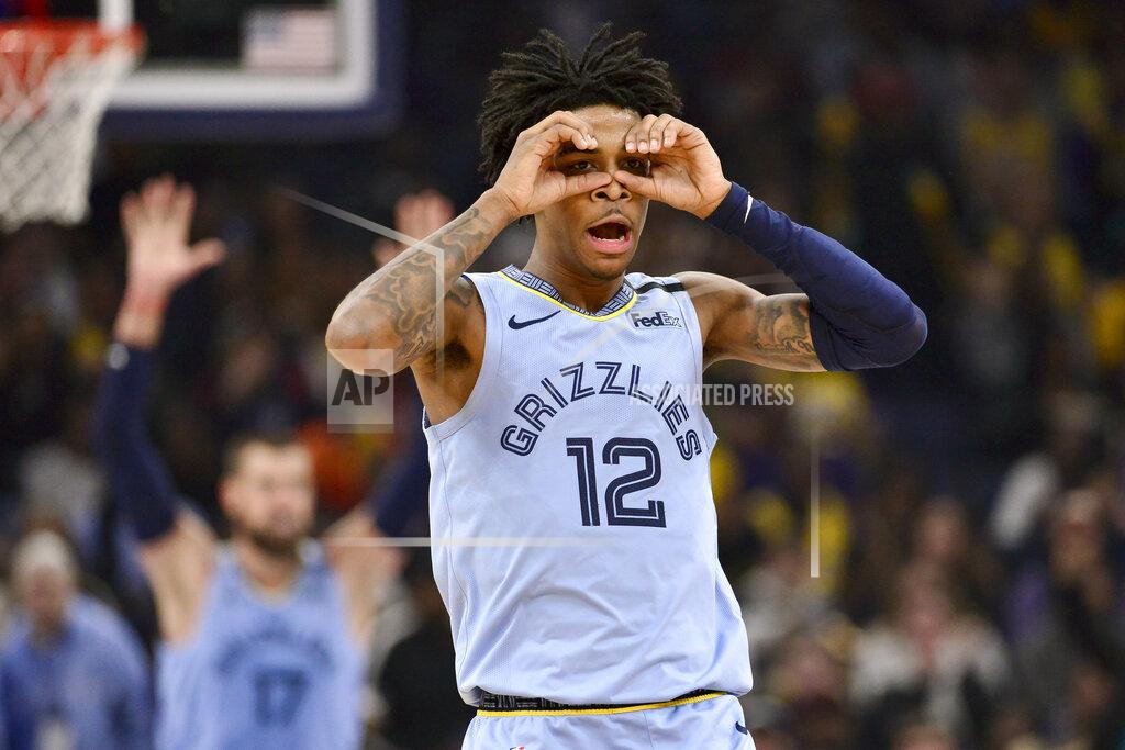 Brandon Dill FILE - In this Feb. 29, 2020, file photo, Memphis Grizzlies guard Ja Morant (12) reacts after an assist to center Jonas Valanciunas (17) in the second half of an NBA basketball game against the Los Angeles Lakers in Memphis, Tenn. The young Grizzlies want to finish what they started, and that's accelerating the rebuilding process by earning the franchise's first playoff berth since 2017. (AP Photo/Brandon Dill, File)