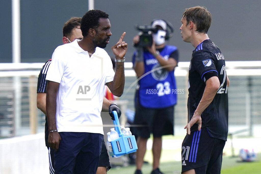 Lynne Sladky CF Montreal head coach Wilfried Nancy, left, talks with midfielder Lassi Lappalainen during the second half of an MLS soccer match against Columbus Crew, Saturday, May 1, 2021, in Fort Lauderdale, Fla. The game ended in a 0-0 tie. (AP Photo/Lynne Sladky)
