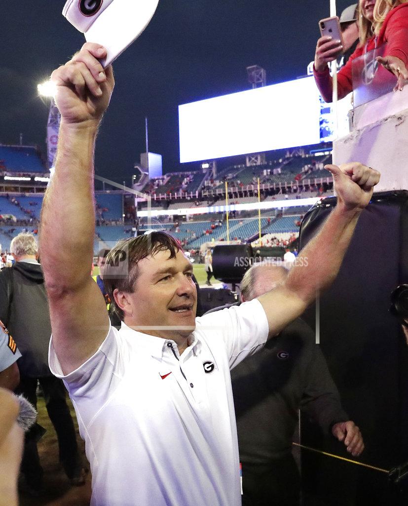 John Raoux Georgia head coach Kirby Smart celebrates in front of fans after defeating Florida in an NCAA college football game Saturday, Oct. 27, 2018, in Jacksonville, Fla. (AP Photo/John Raoux)