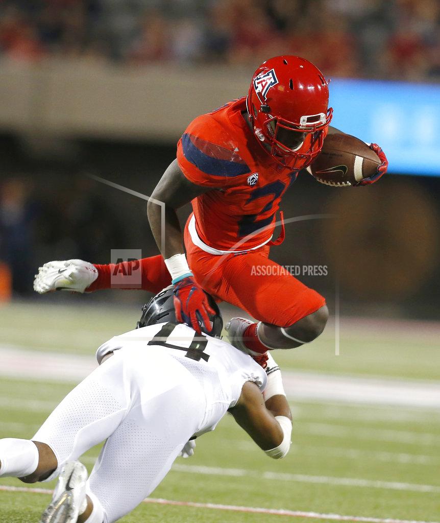 Rick Scuteri Arizona running back J.J. Taylor leaps over Oregon cornerback Thomas Graham Jr. (4) in the second half during an NCAA college football game, Saturday, Oct. 27, 2018, in Tucson, Ariz. (AP Photo/Rick Scuteri)
