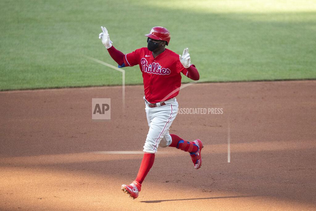 Alex Brandon Philadelphia Phillies' Didi Gregorius celebrates as he rounds the bases for his three-run homer during the first inning of an exhibition baseball game against the Washington Nationals at Nationals Park, Saturday, July 18, 2020, in Washington. (AP Photo/Alex Brandon)