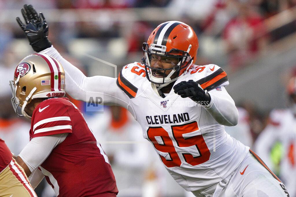 Tony Avelar FILE - In this Oct. 7, 2019, file photo, Cleveland Browns defensive end Myles Garrett (95) sacks San Francisco 49ers quarterback Jimmy Garoppolo during the first half of an NFL football game in Santa Clara, Calif. The Browns are closing in on a massive contract extension with Garrett, a person familiar with the negotiations told the Associated Press on Tuesday, July 14, 2020. Garrett, the No. 1 overall pick in 2017 and one of the NFL's premiere edge rushers, and the team could have the deal completed in the next day or so, said the person who spoke on condition of anonymity because of the sensitivity of the talks. (AP Photo/Tony Avelar, File)