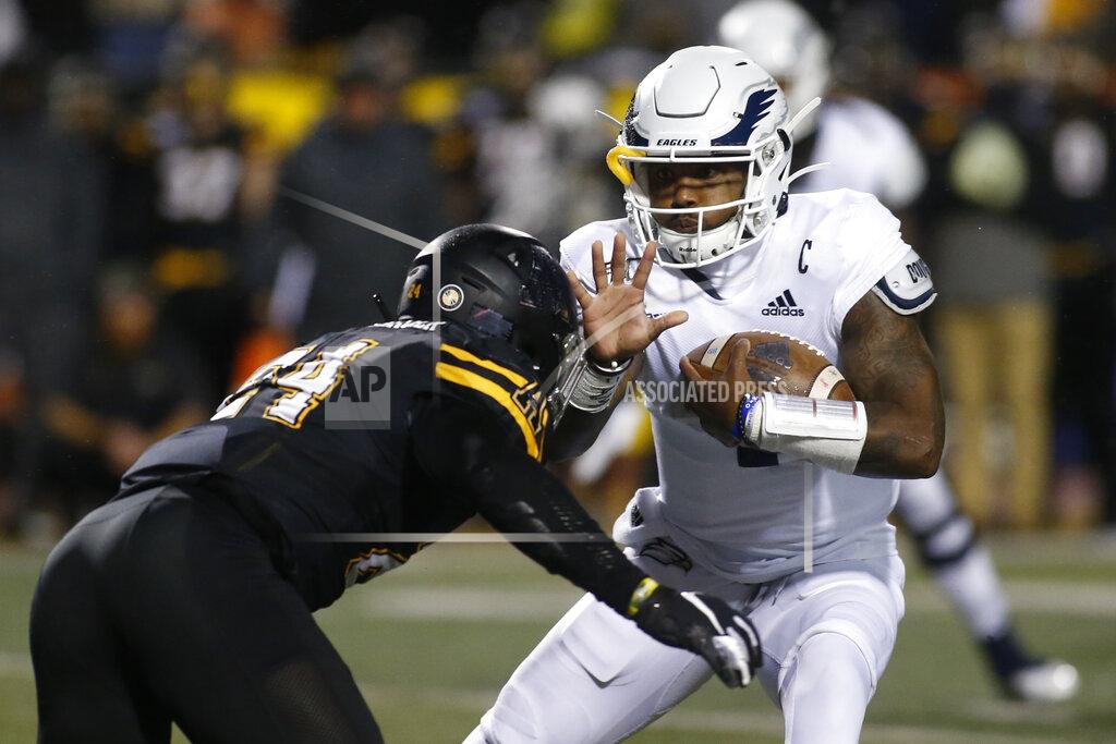 Brian Blanco Georgia Southern quarterback Shai Werts carries as Appalachian State linebacker Akeem Davis-Gaither (24) closes in during the first half of an NCAA college football game Thursday, Oct. 31, 2019, in Boone, N.C. (AP Photo/Brian Blanco)