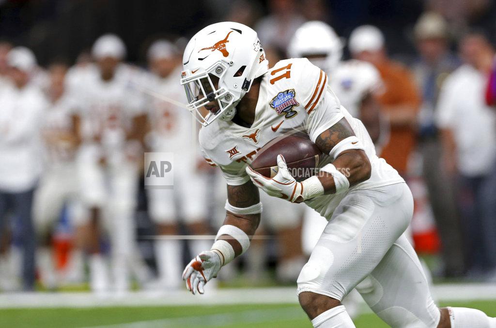Rusty Costanza Texas defensive back P.J. Locke III pulls in an interception of a Georgia pass during the second half of the Sugar Bowl NCAA college football game in New Orleans, Tuesday, Jan. 1, 2019. (AP Photo/Rusty Costanza)