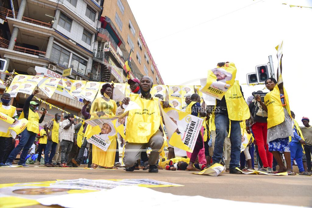 Nicholas Bamulanzeki Supporters of Ugandan President Yoweri Kaguta Museveni celebrate, in Kampala, Uganda, Saturday Jan. 16, 2021, after their candidate was declared winner of the presidential elections. Uganda’s electoral commission says longtime President Yoweri Museveni has won a sixth term, while top opposition challenger Bobi Wine alleges rigging and officials struggle to explain how polling results were compiled amid an internet blackout. In a generational clash widely watched across the African continent, the young singer-turned-lawmaker Wine posed arguably the greatest challenge yet to Museveni. (AP Photo/Nicholas Bamulanzeki)