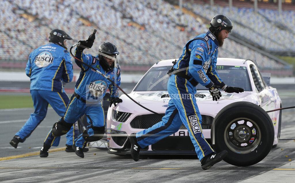 Chuck Burton Crew members perform a pit stop on driver Kevin Harvick's car during qualifying for Saturday's NASCAR All-Star Cup series auto race at Charlotte Motor Speedway in Concord, N.C., Friday, May 17, 2019. (AP Photo/Chuck Burton)