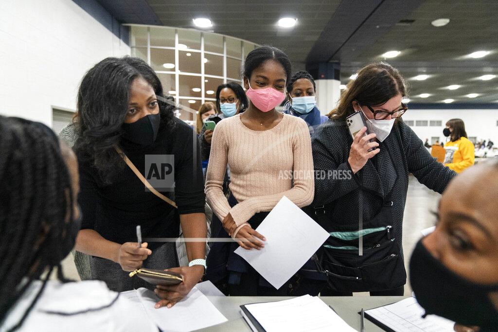 David Goldman Democratic election challengers arrive at the central counting board as ballots are counted into the early morning hours Wednesday, Nov. 4, 2020 in Detroit. (AP Photo/David Goldman)