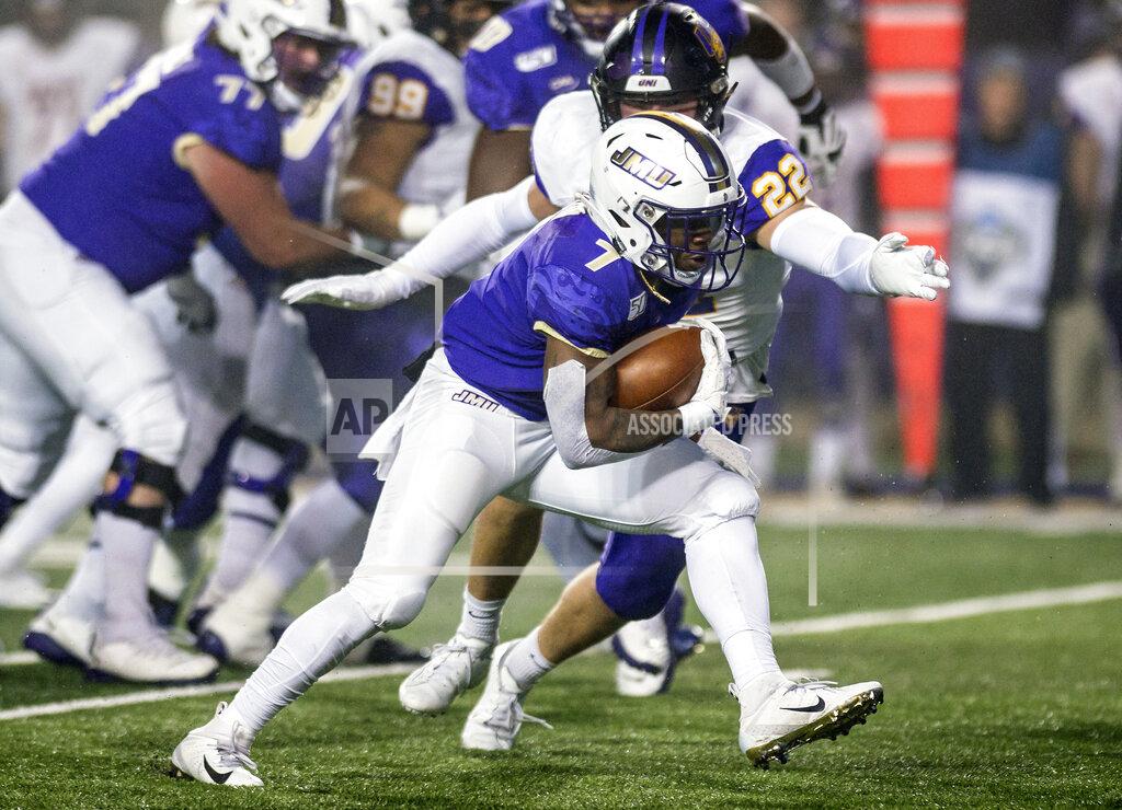 Daniel Lin James Madison running back Jawon Hamilton (7) carries the ball upfield as Northern Iowa linebacker Bryce Flater (22) closes in for a tackle during the first half of a quarterfinal game in the NCAA college Football Championship Subdivision playoffs in Harrisonburg, Va., Friday, Dec. 13, 2019. (Daniel Lin/Daily News-Record via AP)