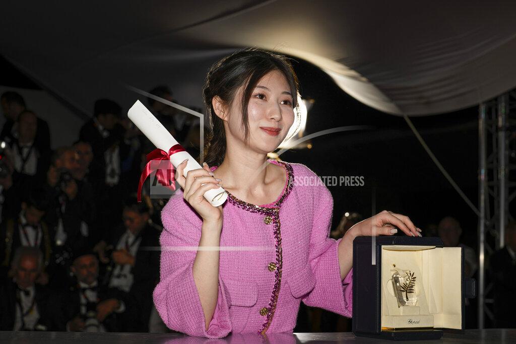 Petros Giannakouris Chie Hayakawa, winner of the special mention for a first time film award for 'Plan 75' poses for photographers during the photo call following the awards ceremony at the 75th international film festival, Cannes, southern France, Saturday, May 28, 2022. (AP Photo/Petros Giannakouris)