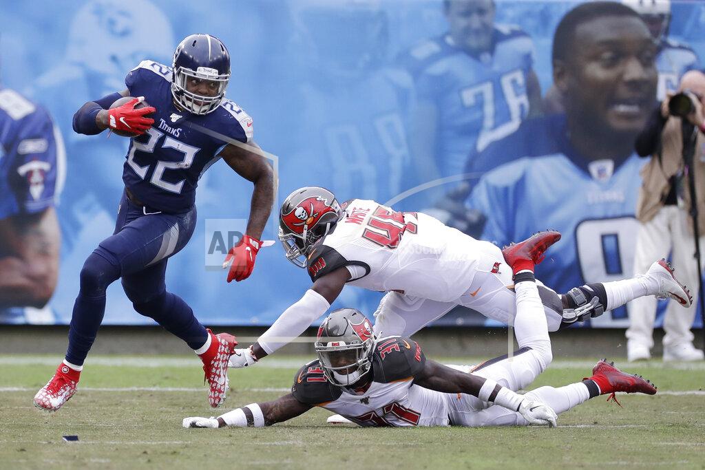 James Kenney Tennessee Titans running back Derrick Henry (22) runs past Tampa Bay Buccaneers defenders Devin White (45) and Jordan Whitehead (31) in the second half of an NFL football game Sunday, Oct. 27, 2019, in Nashville, Tenn. (AP Photo/James Kenney)