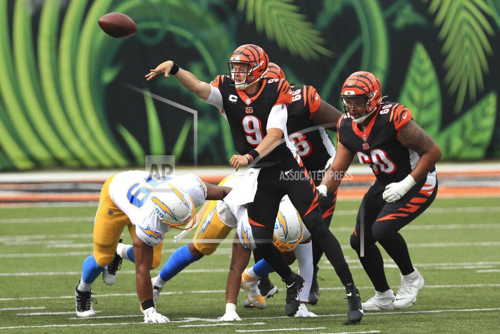 Aaron Doster Cincinnati Bengals quarterback Joe Burrow (9) throws during the first half of an NFL football game against the Los Angeles Chargers, Sunday, Sept. 13, 2020, in Cincinnati. (AP Photo/Aaron Doster)