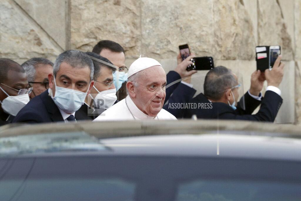 Andrew Medichini Pope Francis leaves the Sayidat al-Nejat (Our Lady of Salvation) Cathedral, in Baghdad, Iraq, Friday, March 5, 2021. Pope Francis has honored victims of one of Iraq's most brutal massacres of Christians by Islamic militants. He is making a visit to Baghdad's Our Lady of Salvation Cathedral, where he has prayed and spoke with priests, seminarians and religious sisters. In 2010, al-Qaida-linked militants gunned down worshippers at the church in an attack that left 58 people dead. (AP Photo/Andrew Medichini)