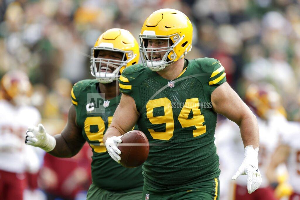 Matt Ludtke Green Bay Packers' Dean Lowry celebrates a fumble recovery during the second half of an NFL football game against the Washington Football Team Sunday, Oct. 24, 2021, in Green Bay, Wis. (AP Photo/Matt Ludtke)