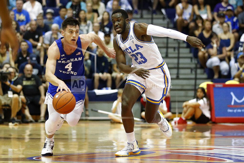Marco Garcia UCLA guard Prince Ali (23) chases down BYU guard Alex Barcello (4) during the first half of an NCAA college basketball game, Monday, Nov. 25, 2019, in Lahaina, Hawaii. (AP Photo/Marco Garcia)