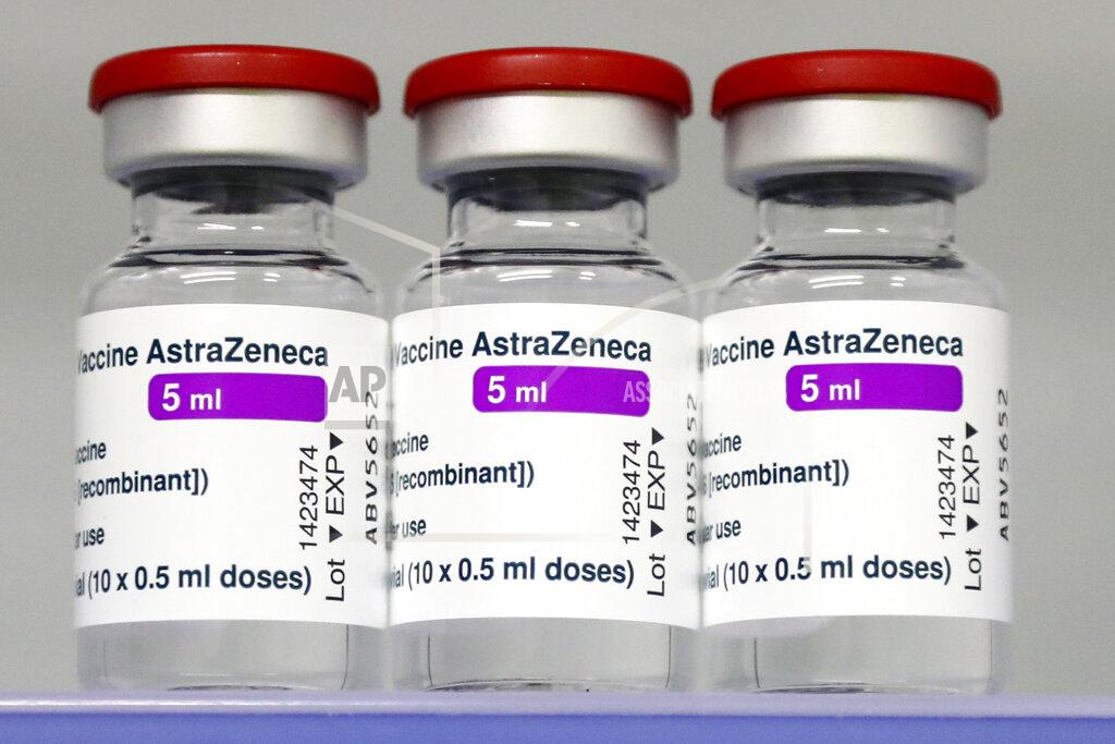 Matthias Schrader FILE - In this March 22, 2021, file photo, vials of the AstraZeneca COVID-19 vaccine sit in a fridge at the local vaccine center in Ebersberg near Munich, Germany. The European Commission will try this week to persuade a Belgian court to order the AstraZeneca pharmaceutical company to deliver millions of doses of its COVID-19 vaccines to EU countries. The EU accuses the Anglo-Swedish drugmaker of failing to deliver the number of shots it agreed. AstraZeneca’s contract signed with the Commission on behalf of all 27 EU member states foresaw an initial 300 million doses for distribution among member countries, with an option for a further 100 million. The doses were expected to be delivered throughout 2021 but only 30 million were sent during the first quarter. (AP Photo/Matthias Schrader, File)