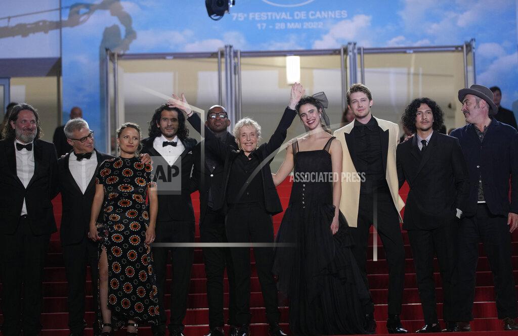 Petros Giannakouris Producer Olivier Delbosc, Hester Ruoff, from third left, Nick Romano, director Claire Denis, sixth from left, Margaret Qualley, Joe Alwyn, Danny Ramirez, and Stuart A. Staples pose for photographers upon arrival at the premiere of the film 'Stars at Noon' at the 75th international film festival, Cannes, southern France, Wednesday, May 25, 2022. (AP Photo/Petros Giannakouris)