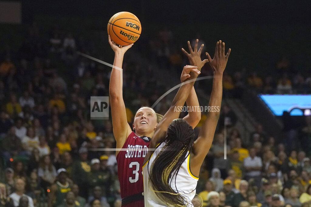 Lm Otero South Dakota center Hannah Sjerven, left, shoots against Baylor center Queen Egbo during the first half of a college basketball game in the second round of the NCAA tournament in Waco, Texas, Sunday, March 20, 2022. (AP Photo/LM Otero)