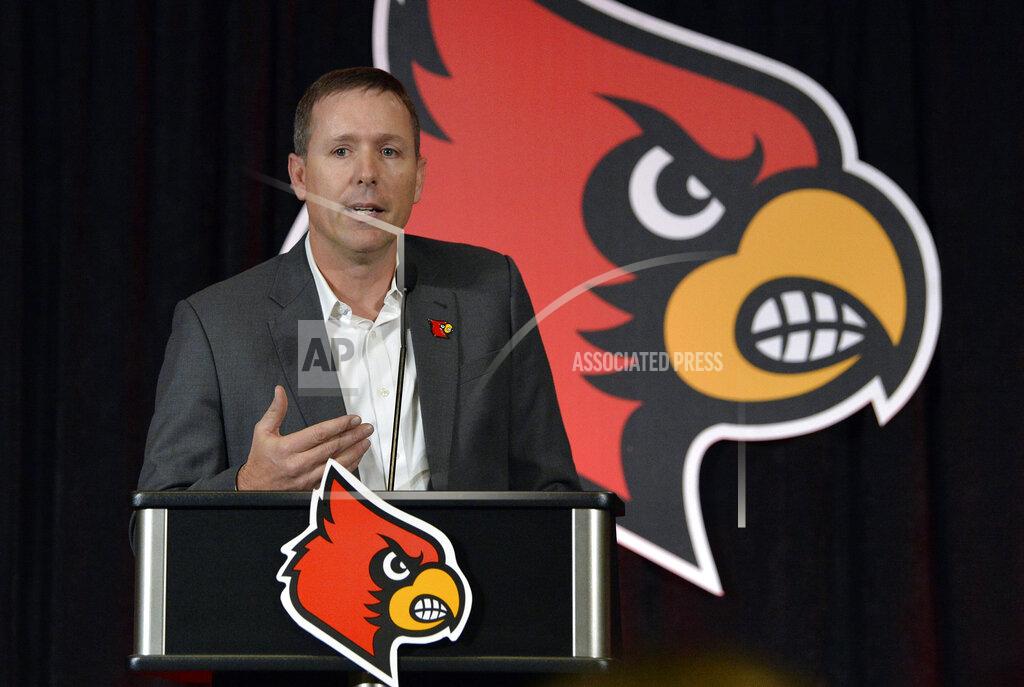 FILE - In this Dec. 4, 2018, file photo, Scott Satterfield speaks to the media and gathered fans following the announcement of his hiring as Louisville's new head NCAA college football coach in Louisville, Ky. The first-year Louisville coach changed the Cardinals’ football schedule to finish workouts before spring break. Satterfield has said he wants more time to evaluate the players he has and identify needs with rebuilding Louisville coming off a 2-10 season. (AP Photo/Timothy D. Easley, File)