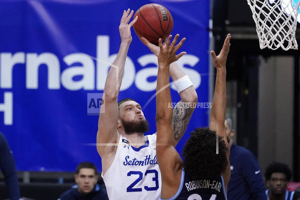 Mary Altaffer Seton Hall forward Sandro Mamukelashvili (23) goes to the basket over Villanova forward Villanova forward Jeremiah Robinson-Earl (24) during the first half of an NCAA college basketball game, Saturday, Jan. 30, 2021, in Newark, N.J. (AP Photo/Mary Altaffer)