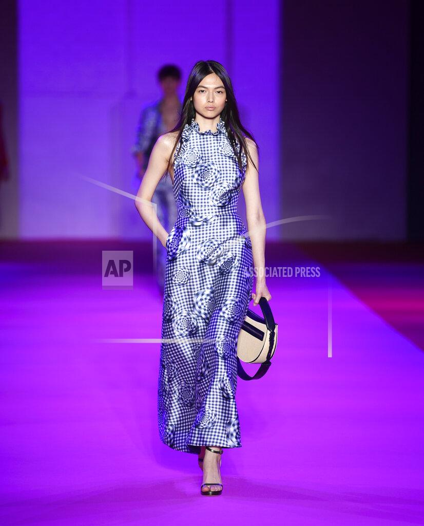 Evan Agostini A model walks the runway at the Brandon Maxwell spring/summer 2022 fashion show in the Brooklyn borough of New York during Fashion Week on Friday, Sept. 10, 2021. (Photo by Evan Agostini/Invision/AP)
