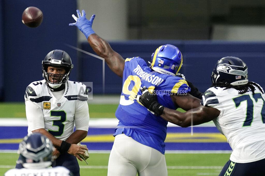 Jae C. Hong Seattle Seahawks quarterback Russell Wilson (3) throws under pressure from Los Angeles Rams defensive tackle A'Shawn Robinson during the first half of an NFL football game Sunday, Nov. 15, 2020, in Inglewood, Calif. (AP Photo/Jae C. Hong)