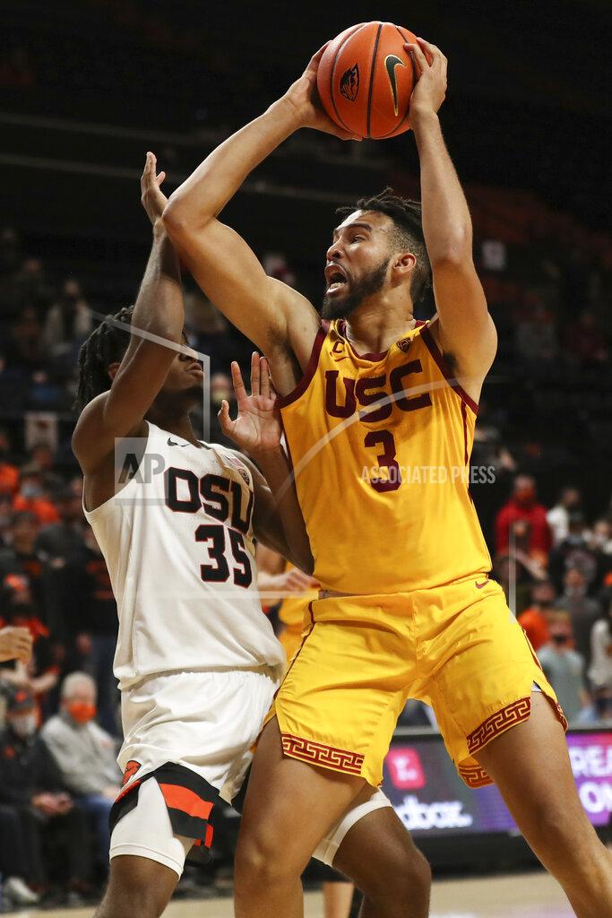 Amanda Loman Southern California forward Isaiah Mobley collides with Oregon State forward Glenn Taylor Jr. during the second half of an NCAA college basketball game Thursday, Feb. 24, 2022, in Corvallis, Ore. Southern California won 94-91. (AP Photo/Amanda Loman)