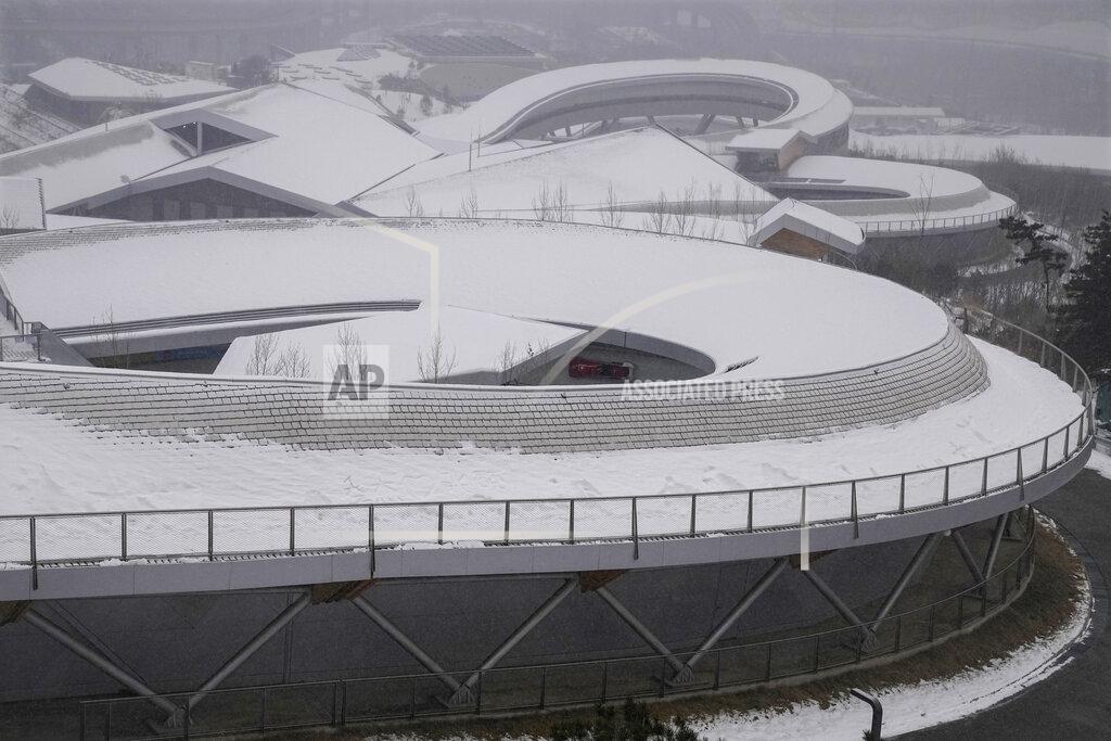 Pavel Golovkin Melanie Hasler and Nadja Pasternack of Switzerland speed along the track during a 2-woman bobsled training at the 2022 Winter Olympics, Thursday, Feb. 17, 2022, in the Yanqing district of Beijing. (AP Photo/Pavel Golovkin)