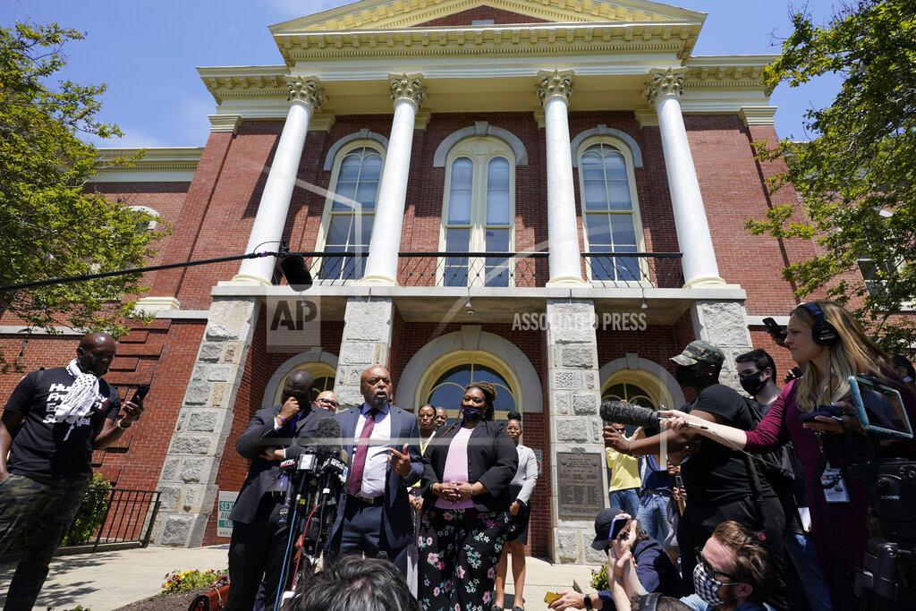 Steve Helber Attorneys for the family of Andrew Brown, Wayne Kendall, at podium, makes comments after a judges decision on the release body cam video of the shooting of Andrew Brown Jr. in Elizabeth City, N.C., Wednesday, April 28, 2021. A judge denied the request to immediately release body cam video of the incident. (AP Photo/Steve Helber)