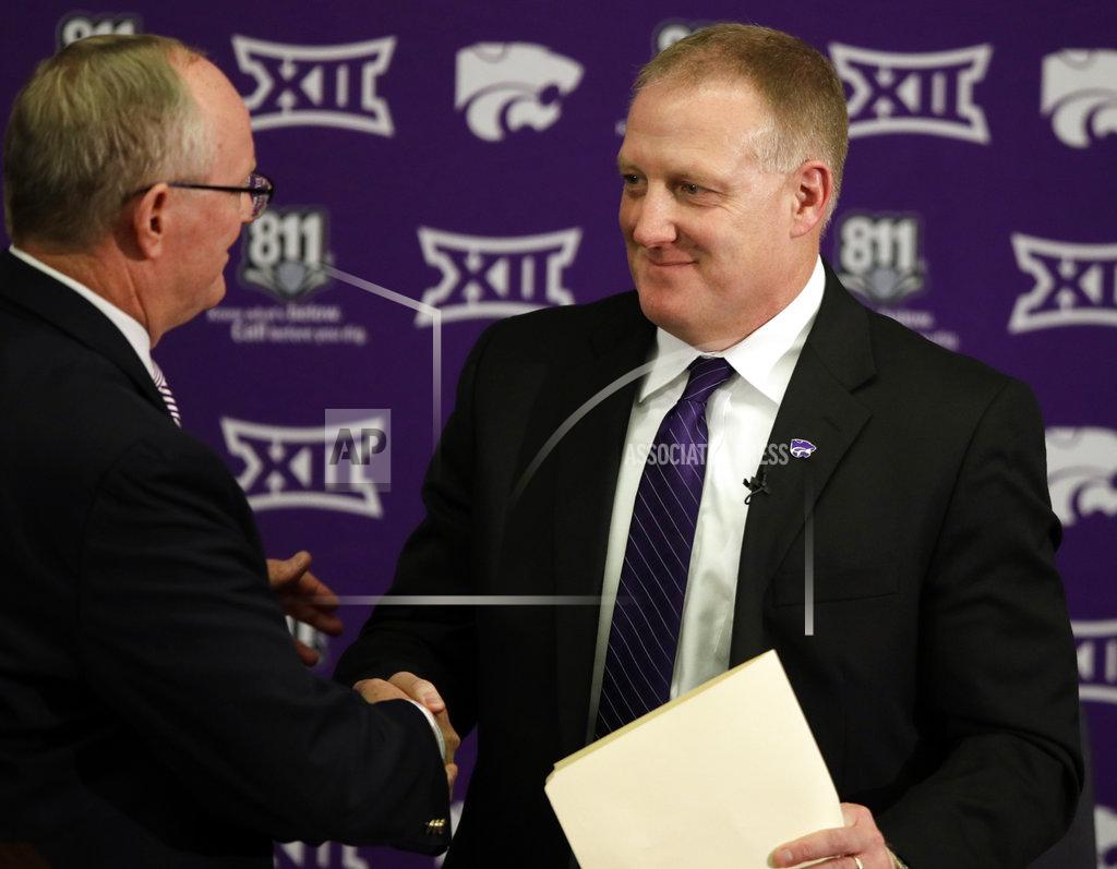 Orlin Wagner Chris Klieman, right, is introduced as the 35th Kansas State NCAA college football head coach by athletic director Gene Taylor, left, in Manhattan, Kan., Wednesday, Dec. 12, 2018. (AP Photo/Orlin Wagner)