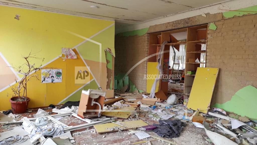 Inna Levchenko This April 24, 2022 photo provided by Inna Levchenko shows damage from Russian shelling to School No. 21, in Chernihiv, Ukraine. Levchenko opened the school as a shelter to hundreds of frightened families. Though she didn’t know it yet, 70 children she’d ordered to shelter in the basement would survive the blast. But at least nine people, including one of her students — a 13-year-old boy — would not. (Inna Levchenko via AP)