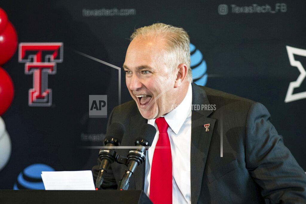 John Moore FILE - New Texas Tech head football coach Joey McGuire speaks during an NCAA college football news conference Nov. 9, 2021, at Jones AT&T Stadium in Lubbock, Texas. Texas New TCU coach Sonny Dykes and Texas Tech’s Joey McGuire wrapped up their first spring drills without naming a starter, though both inherited multiple quarterbacks with starting experience. (John Moore/Lubbock Avalanche-Journal via AP, File)