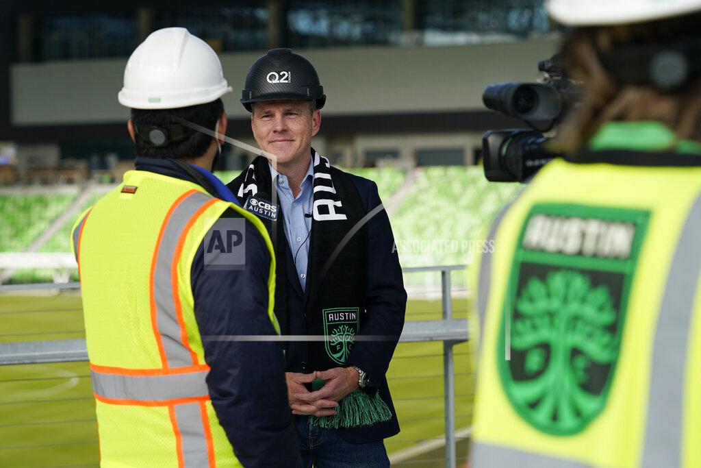 Eric Gay Q2 Holdings Inc. CEO Matt Flake, center, talks with the media following a ribbon cutting where the Austin FC's new stadium was named Q2 Stadium, Monday, Jan. 25, 2021, in Austin, Texas. (AP Photo/Eric Gay)