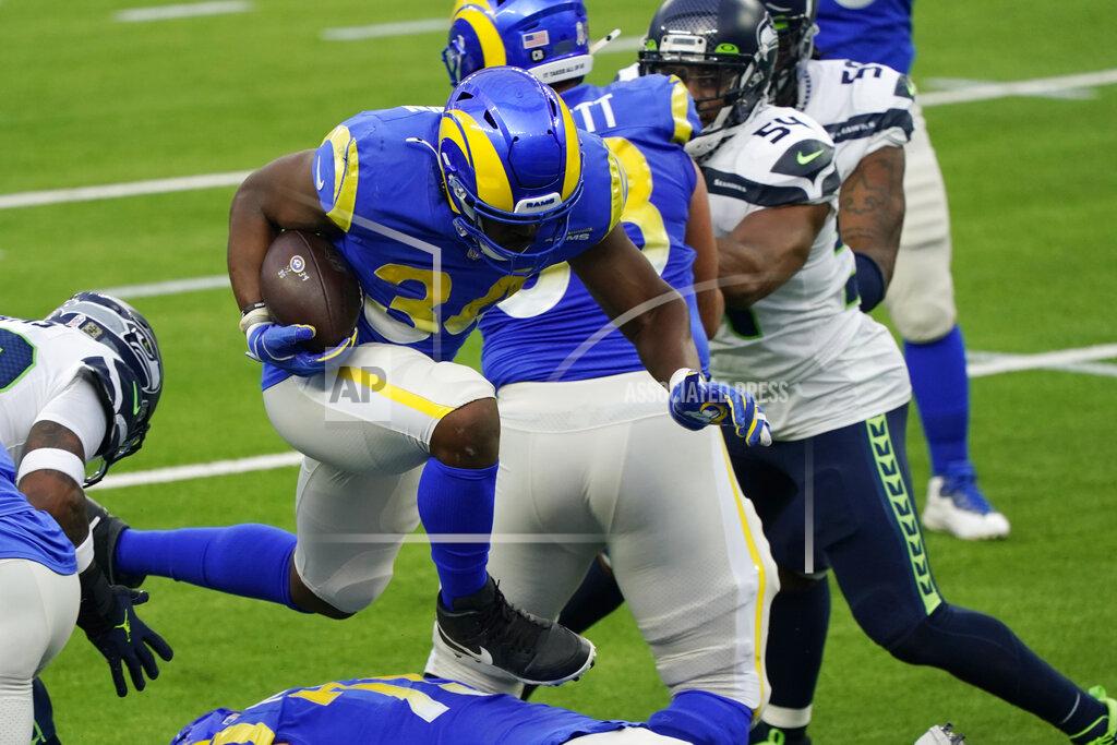 Ashley Landis Los Angeles Rams running back Malcolm Brown (34) leaps over an offensive lineman on his way to score a rushing touchdown during the first half of an NFL football game against the Seattle Seahawks Sunday, Nov. 15, 2020, in Inglewood, Calif. (AP Photo/Ashley Landis)
