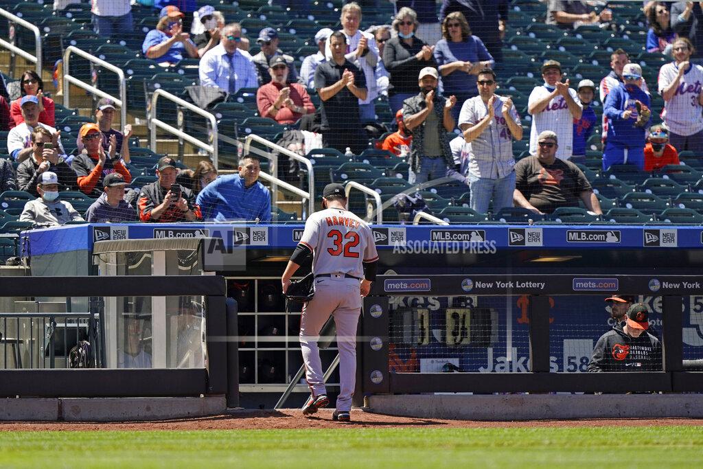 Kathy Willens Fans stand and applaud Baltimore Orioles starting pitcher Matt Harvey (32) as he leaves the mound during the fifth inning of a baseball game against his former team, the New York Mets, Wednesday, May 12, 2021, in New York. (AP Photo/Kathy Willens)