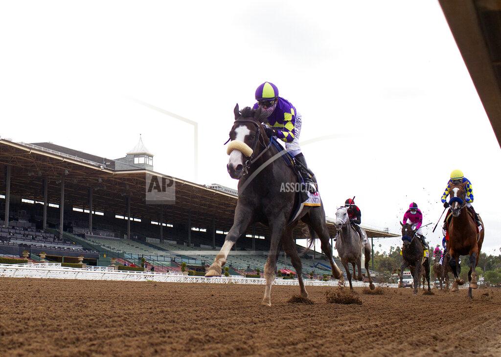 Uncredited In a photo provided by Benoit Photo, C R K Stable's Honor A.P. and jockey Mike Smith win the Grade I $400,000 RUNHAPPY Santa Anita Derby Saturday, June 6, 2020 at Santa Anita Park in Arcadia, Calif.(Benoit Photo via AP)