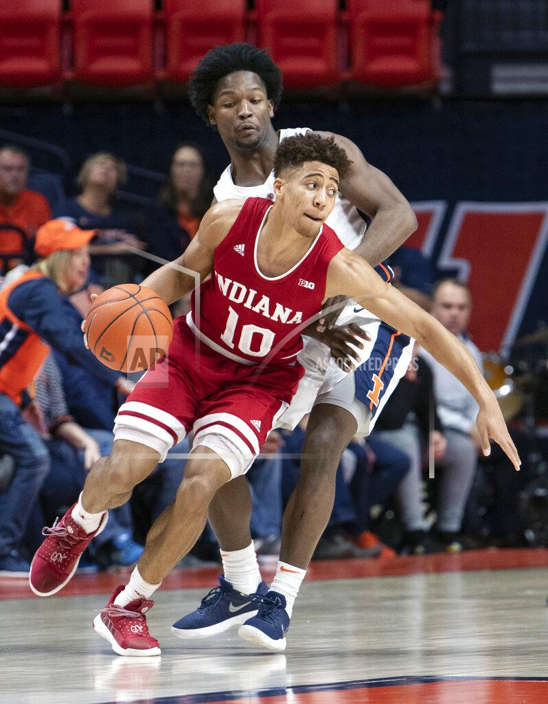 Stephen Haas Indiana guard Rob Phinisee protects the ball from the defense of Illinois guard Andres Feliz, rear, during the first half of an NCAA college basketball game in Champaign, Ill., Thursday, March 7, 2019. (AP Photo/Stephen Haas)
