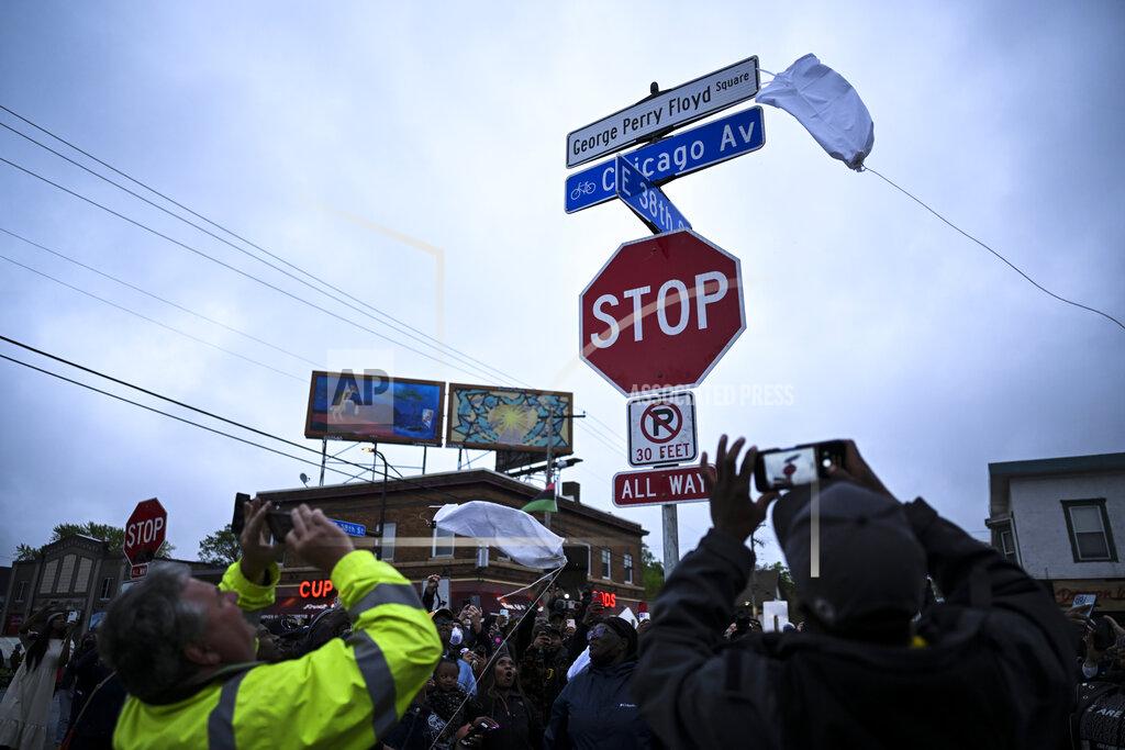 Aaron Lavinsky A new George Perry Floyd Square sign is unveiled in front of hundreds of community members Wednesday, May 25, 2022, in Minneapolis. The intersection where Floyd died at the hands of Minneapolis police officers was renamed in his honor Wednesday, among a series of events to remember a man whose killing forced America to confront racial injustice. (Aaron Lavinsky/Star Tribune via AP)