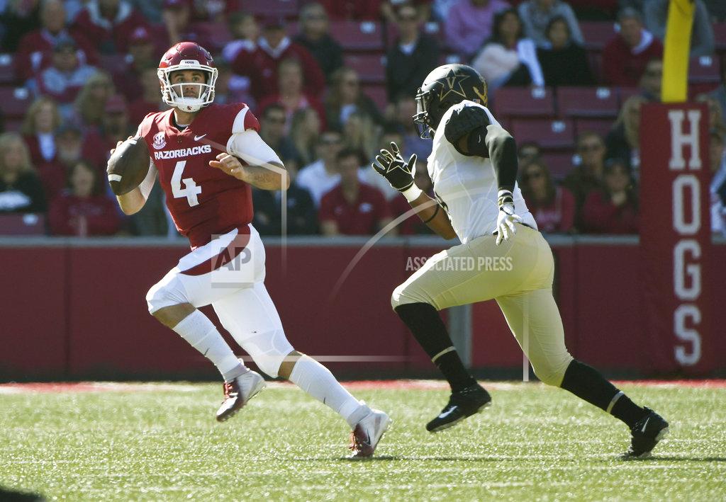Michael Woods Arkansas quarterback Ty Storey tries to get away from Vanderbilt defender Caleb Peart in the first half of an NCAA college football game Saturday, Oct. 27, 2018, in Fayetteville, Ark. (AP Photo/Michael Woods)